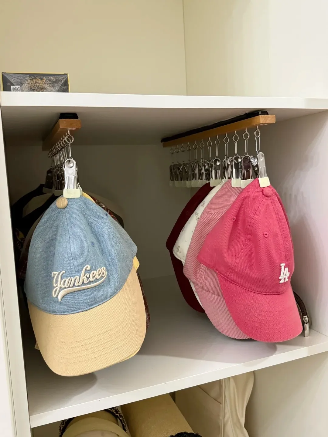 Hanging baseball caps inside the closet makes better use of vertical storage space.